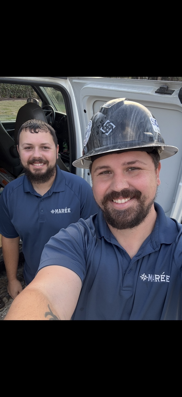 Marée Hardwood Flooring team members, with Seth Maree in the background