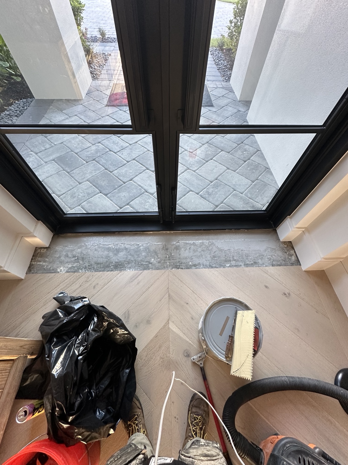 Prepared subfloor at the entryway, ready for replacement boards