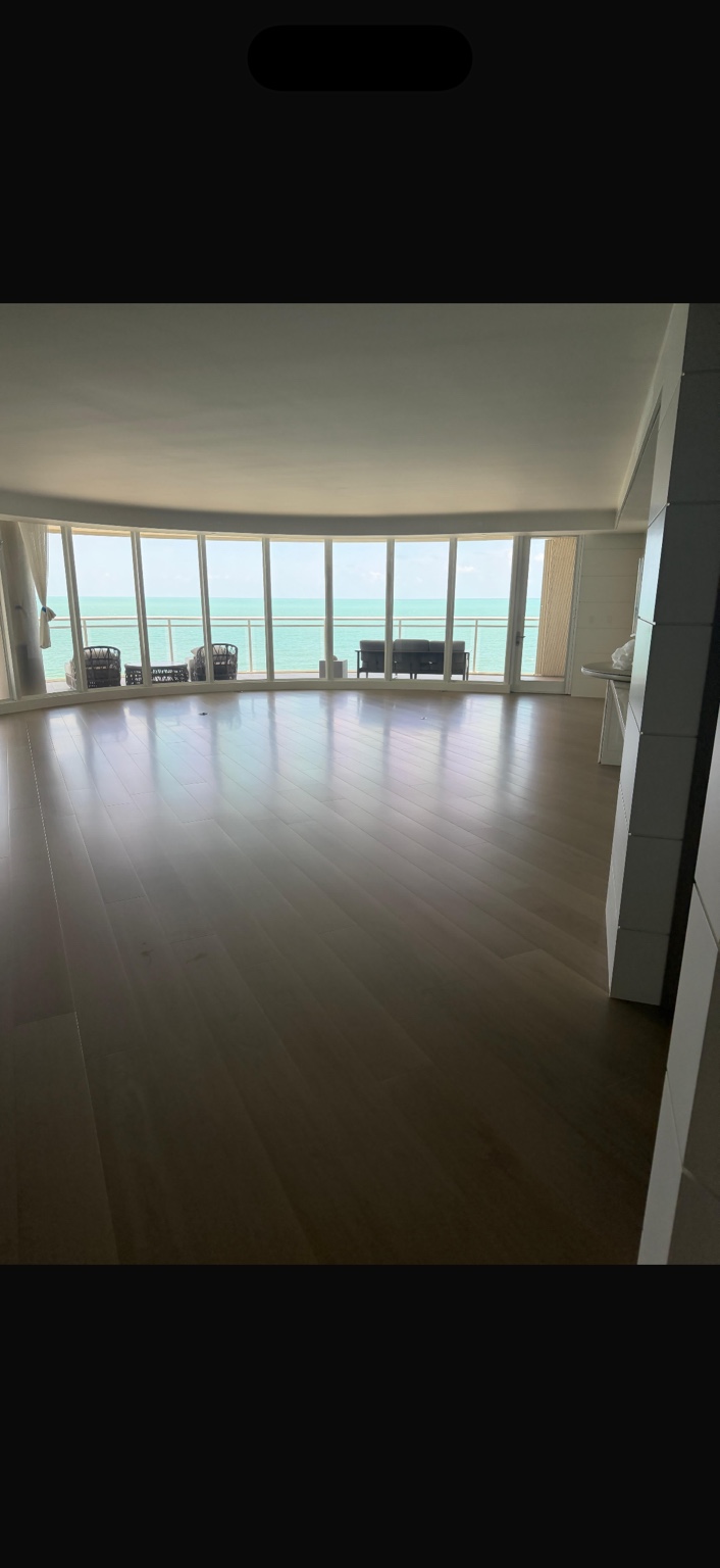 Light hardwood floor in a waterfront living room